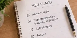 Caderno com o plano: alimentação, suplementação, estratégias e metas.